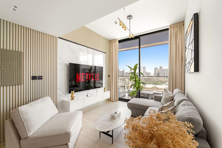 Elegantly designed living room with modern furnishings in an apartment at Building Street 11 - vayk-vacation-homes-rental-llc - 1257271 - DXB in Jumeirah Village, Dubai Elegantly designed living room with modern furnishings in an apartment at Building Street 11 - vayk-vacation-homes-rental-llc - 1257271 - DXB in Jumeirah Village, Dubai