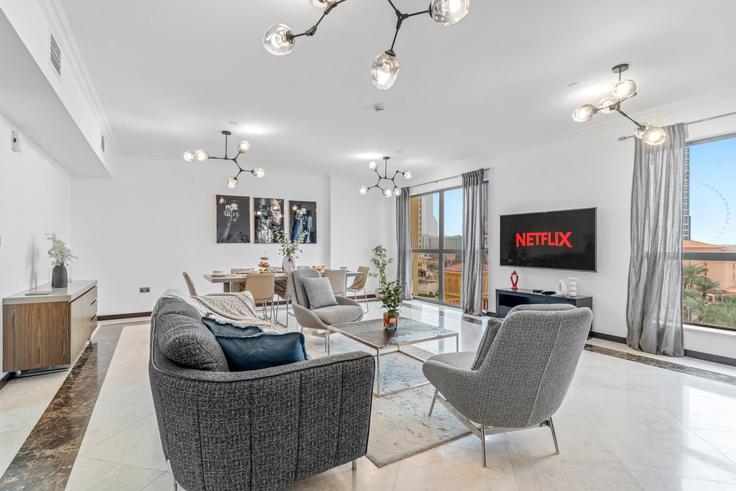 Elegantly designed living room with modern furnishings in an apartment at Building Breih Street - vayk-vacation-homes-rental-llc - 1355265 in Dubai Marina, Dubai