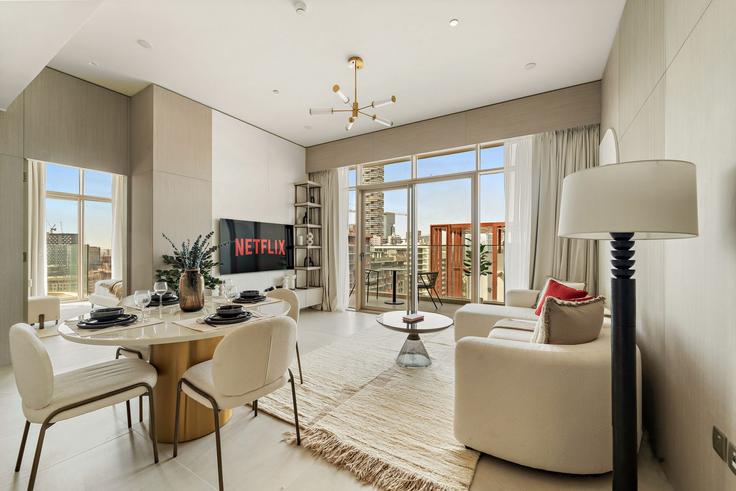 Salle de séjour élégante avec mobilier moderne dans un appartement à Building D12-H04 - vayk-vacation-homes-rental-llc - 1369676 à Al Barsha South Fourth, Dubai Salle de séjour élégante avec mobilier moderne dans un appartement à Building D12-H04 - vayk-vacation-homes-rental-llc - 1369676 à Al Barsha South Fourth, Dubai