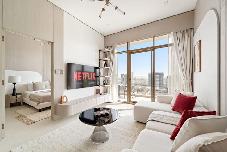 Salle de séjour élégante avec mobilier moderne dans un appartement à Building D12-H04 - vayk-vacation-homes-rental-llc - 1369677 à Al Barsha South Fourth, Dubai Salle de séjour élégante avec mobilier moderne dans un appartement à Building D12-H04 - vayk-vacation-homes-rental-llc - 1369677 à Al Barsha South Fourth, Dubai