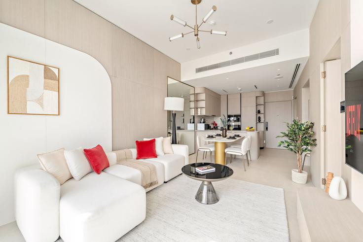 Sala de estar elegantemente projetada com móveis modernos em um apartamento no Building D12-H04 - vayk-vacation-homes-rental-llc - 1369677 em Al Barsha South Fourth, Dubai Sala de estar elegantemente projetada com móveis modernos em um apartamento no Building D12-H04 - vayk-vacation-homes-rental-llc - 1369677 em Al Barsha South Fourth, Dubai
