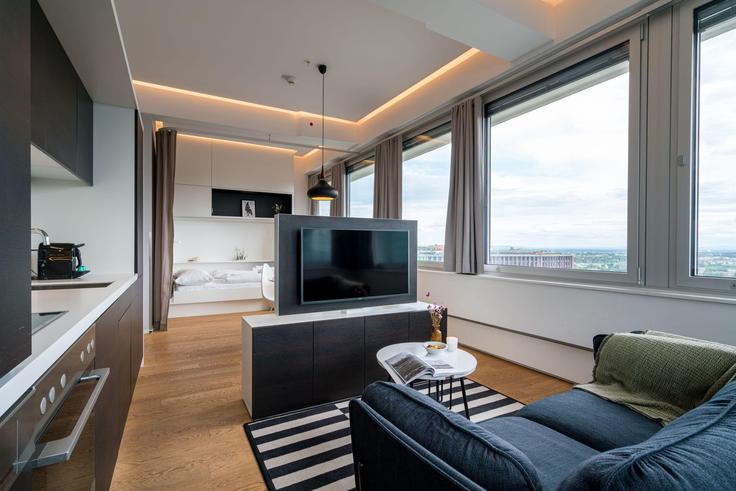 Salle de séjour élégante avec mobilier moderne dans un appartement à Building Wienerbergstraße - viennaresidences - 1242249 - VIE à Vienna, Vienna