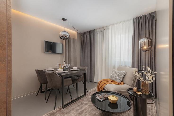 Elegantly designed living room with modern furnishings in an apartment at Building Nauenstrasse - visionapartments - 1365884 in Basel, Basel