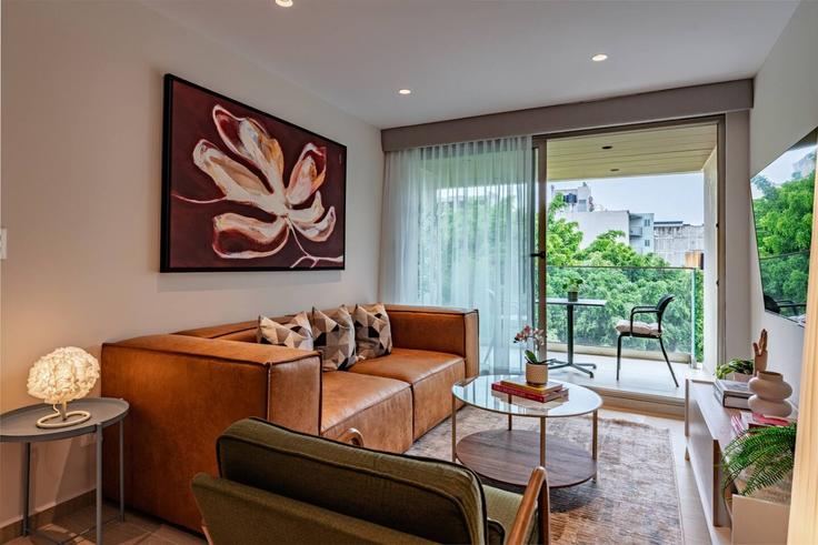 Mexico City, Mexico City에 위치한 Building Avenida Nuevo León - viva-houses-beyond-corp - 1584760 유닛의 세련된 인테리어가 돋보이는 거실 Mexico City, Mexico City에 위치한 Building Avenida Nuevo León - viva-houses-beyond-corp - 1584760 유닛의 세련된 인테리어가 돋보이는 거실