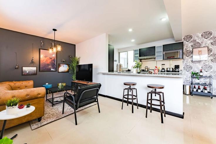 Elegante sala de estar con mobiliario moderno en un apartamento en Building Avenida Álvaro Obregón - viva-houses-beyond-corp - 1592261 en Mexico City, Mexico City