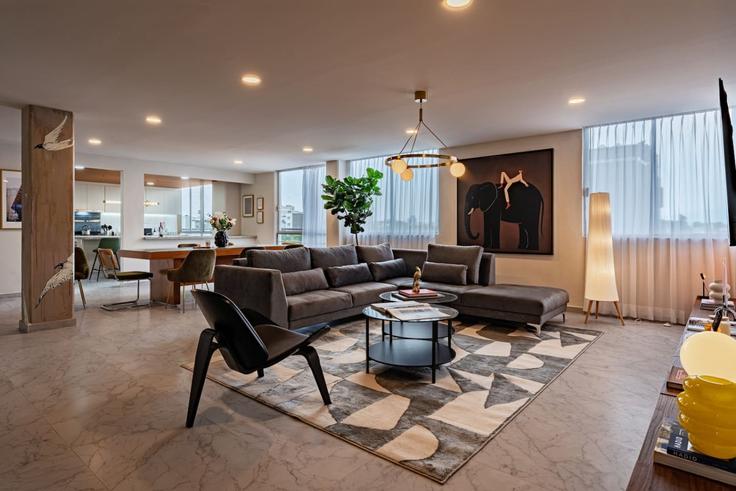 Elegante sala de estar con mobiliario moderno en un apartamento en Building Tepic - viva-houses-beyond-corp - 1592282 en Mexico City, Mexico City