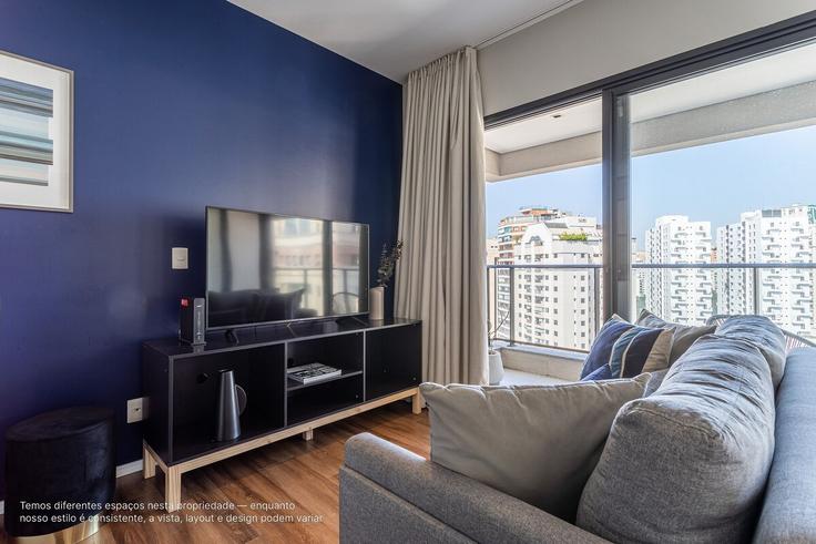 Elegante sala de estar con mobiliario moderno en un apartamento en Building Rua Doutor Eduardo de Souza Aranha - viva - 1521188 en Vila Nova Conceição, São Paulo