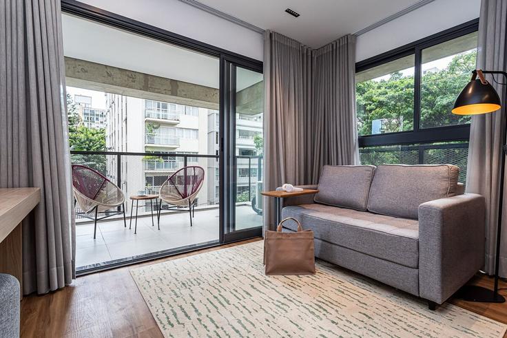 Sala de estar elegantemente projetada com móveis modernos em um apartamento no Building Jardim Itu - viva - 1521306 em Cerqueira César, São Paulo Sala de estar elegantemente projetada com móveis modernos em um apartamento no Building Jardim Itu - viva - 1521306 em Cerqueira César, São Paulo