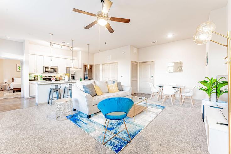 Elegantly designed living room with modern furnishings in an apartment at Building Montopolis Drive - vivant - 1462769 in Austin, Austin