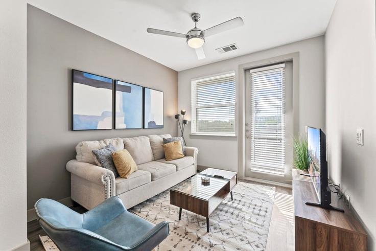 Elegantly designed living room with modern furnishings in an apartment at Building East Riverside Drive - vivant - 1462796 in Austin, Austin