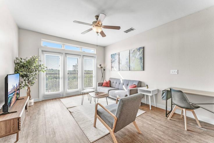 Elegantly designed living room with modern furnishings in an apartment at Building East Oltorf Street - vivant - 1462792 in Austin, Austin