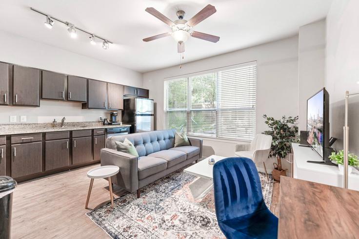 Elegantly designed living room with modern furnishings in an apartment at Building East Oltorf Street - vivant - 1462776 in Austin, Austin