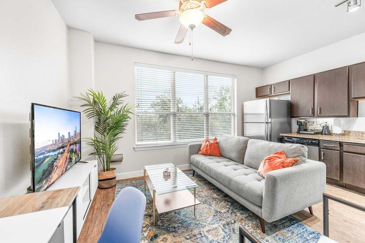 Elegantly designed living room with modern furnishings in an apartment at Building East Oltorf Street - vivant - 1462739 in Austin, Austin