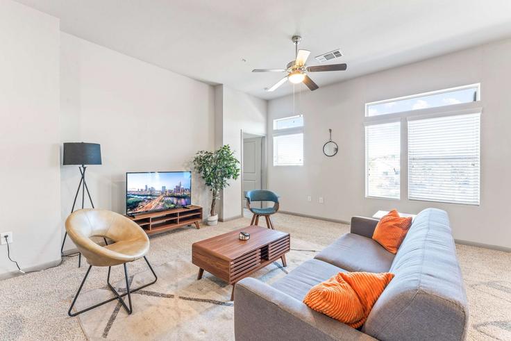 Elegantly designed living room with modern furnishings in an apartment at Building Montopolis Drive - vivant - 1462790 in Austin, Austin