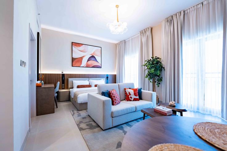 Sala de estar elegantemente projetada com móveis modernos em um apartamento no Building Yas Street - voyage-vacation-home-rental-llc - 1364180 em Yas Island, Abu Dhabi