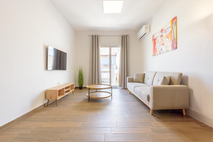 Elegantly designed living room with modern furnishings in an apartment at Building Αμεινοκλέους - wehost-athens-ike - 1648228 in Central Athens, Athens Elegantly designed living room with modern furnishings in an apartment at Building Αμεινοκλέους - wehost-athens-ike - 1648228 in Central Athens, Athens