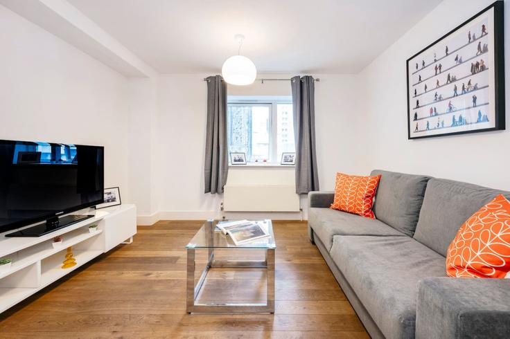 Salle de séjour élégante avec mobilier moderne dans un appartement à Building West Central Street - welcome-london-ltd - 1511487 à London Borough of Camden, London Salle de séjour élégante avec mobilier moderne dans un appartement à Building West Central Street - welcome-london-ltd - 1511487 à London Borough of Camden, London