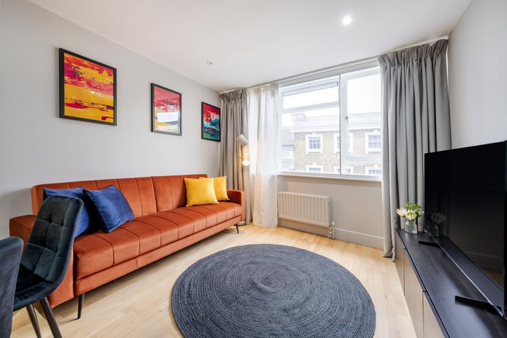 Elegante sala de estar con mobiliario moderno en un apartamento en Building Saint Martin's Lane - welcome-london-ltd - 1511519 en City of Westminster, London Elegante sala de estar con mobiliario moderno en un apartamento en Building Saint Martin's Lane - welcome-london-ltd - 1511519 en City of Westminster, London