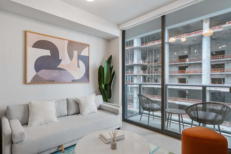 Elegantly designed living room with modern furnishings in an apartment at Building Northeast 6th Street - whost - 1373698 in Miami, Miami Elegantly designed living room with modern furnishings in an apartment at Building Northeast 6th Street - whost - 1373698 in Miami, Miami