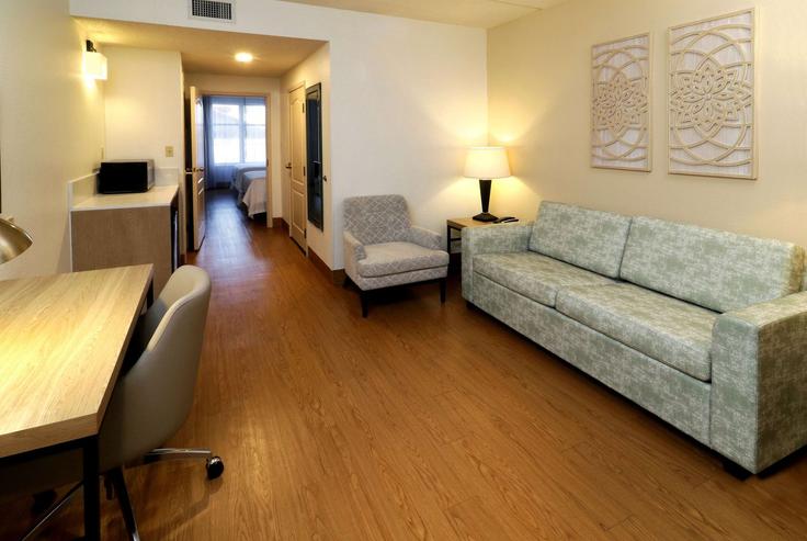 Elegantly designed living room with modern furnishings in an apartment at Building South 10th Street - wyndham - 1688967 in McAllen, McAllen