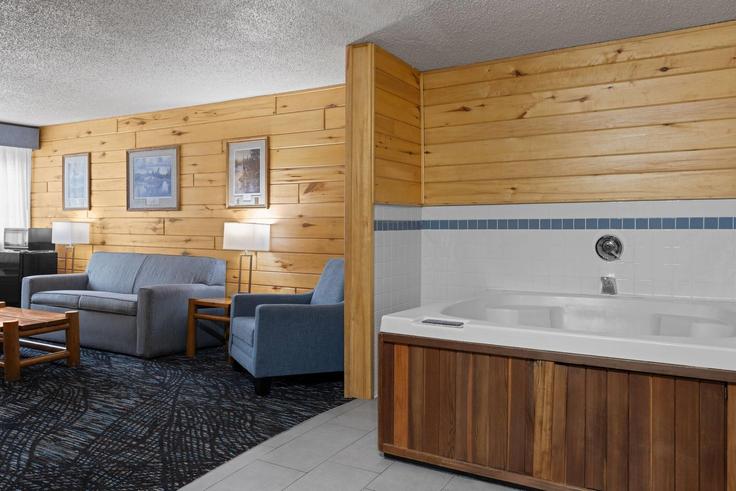 Sala de estar elegantemente projetada com móveis modernos em um apartamento no Building Westgate Boulevard - wyndham - 1678747 em Proctor, Proctor Sala de estar elegantemente projetada com móveis modernos em um apartamento no Building Westgate Boulevard - wyndham - 1678747 em Proctor, Proctor