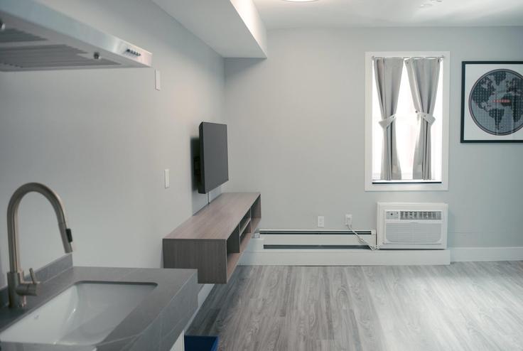 Elegantly designed living room with modern furnishings in an apartment at Building Government Road West - wyndham - 1668167 in Kirkland Lake, Kirkland Lake