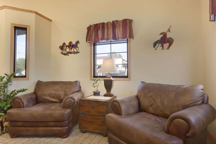 Elegantly designed living room with modern furnishings in an apartment at Building Glenn Street - wyndham - 1685254 in Wall, Wall