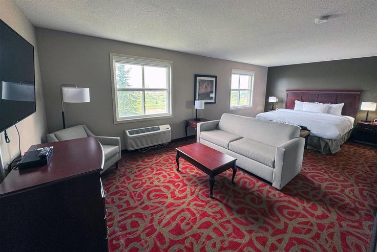 Sherwood Park Sherwood ParkのBuilding Broadway Boulevard - wyndham - 1652804のアパートメントにある、モダンな家具を備えたエレガントなデザインのリビングルーム Sherwood Park Sherwood ParkのBuilding Broadway Boulevard - wyndham - 1652804のアパートメントにある、モダンな家具を備えたエレガントなデザインのリビングルーム