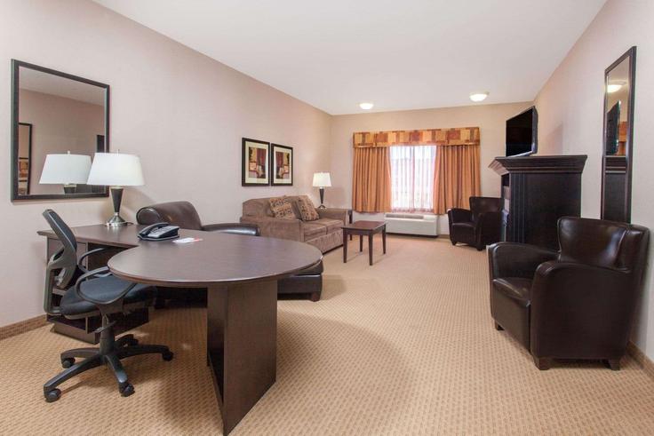 Elegantly designed living room with modern furnishings in an apartment at Building 2A Street West - wyndham - 1657503 in Brooks, Brooks