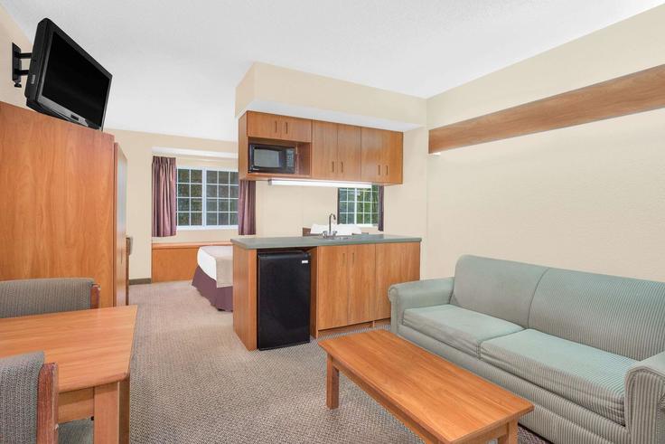 Elegantly designed living room with modern furnishings in an apartment at Building Central Avenue - wyndham - 1666801 in Beckley, Beckley