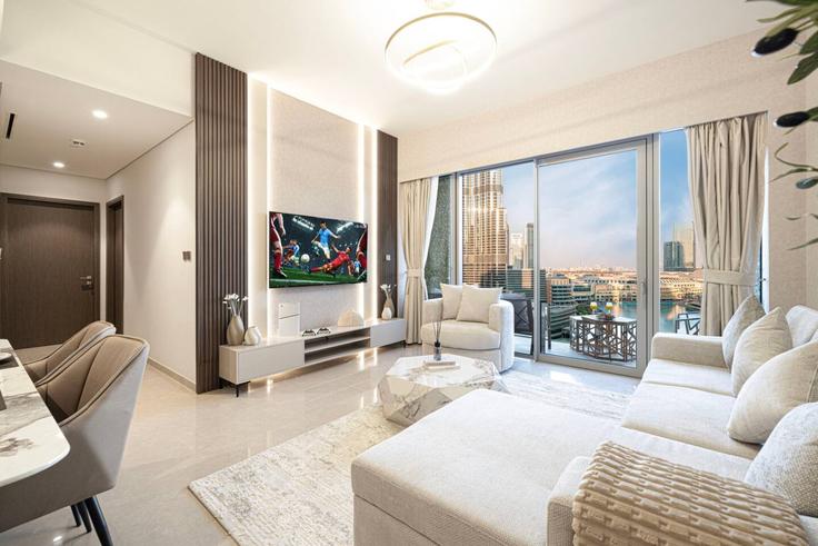 Elegante sala de estar con mobiliario moderno en un apartamento en Building Tariaq Bedon Esm - yado-vacation-home-rental-llc - 1461436 en Burj Khalifa, Dubai
