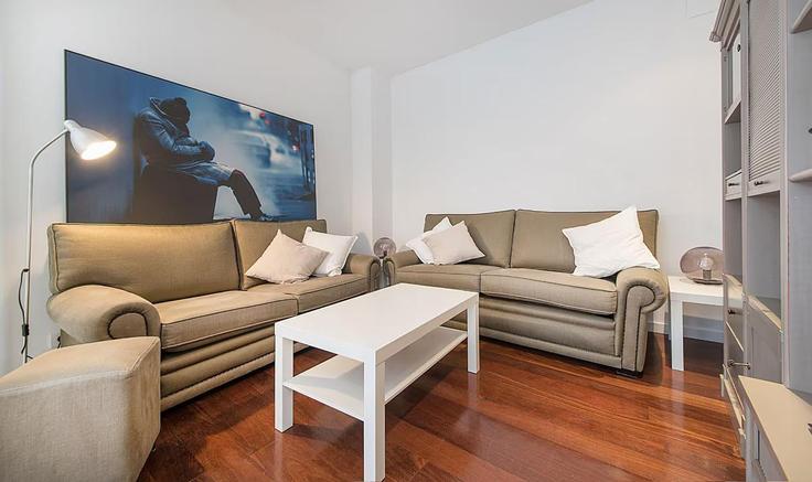 Elegante sala de estar con mobiliario moderno en un apartamento en Building Carrer de Bailèn - youstylish-apartments - 1325115 en Eixample, Barcelona