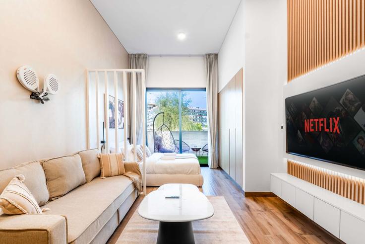 Elegantly designed living room with modern furnishings in an apartment at Building Tariaq Bedon Esm - zarrien-holiday-homes - 1421751 in Jumeirah Village, Dubai Elegantly designed living room with modern furnishings in an apartment at Building Tariaq Bedon Esm - zarrien-holiday-homes - 1421751 in Jumeirah Village, Dubai