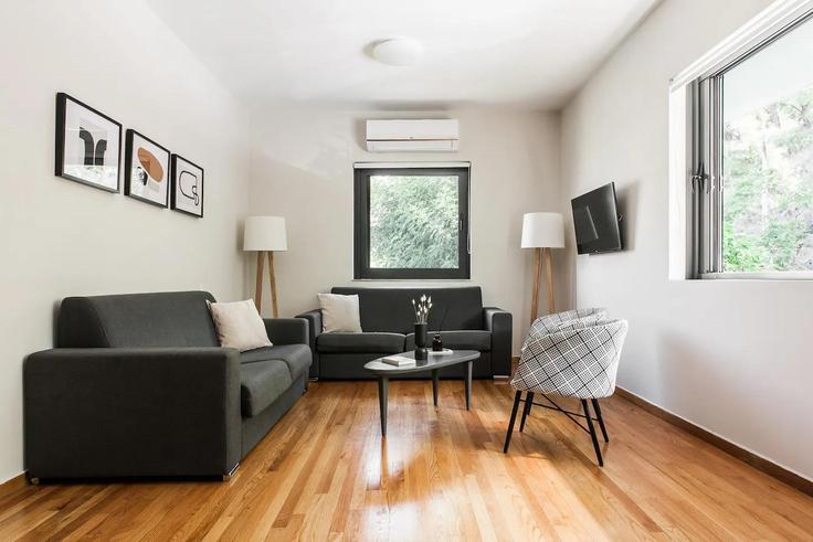 Elegantly designed living room with modern furnishings in an apartment at Building Kosma Melodou - zoialiving - 1038737 - ATH in Central Athens, Athens