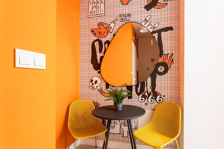 Dining table with stylish chairs in an apartment at Building Georgiou Gennadiou - zoialiving - 1038706 - ATH in Central Athens, Athens