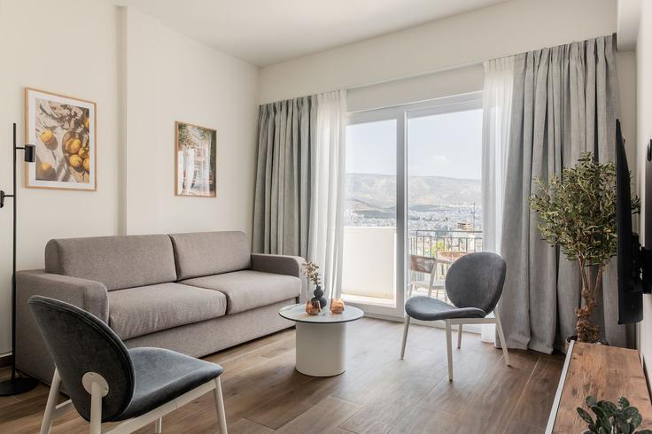 Athens Central AthensのBuilding Kleomenous - zoialiving - 1299439 - ATHのアパートメントにある、モダンな家具を備えたエレガントなデザインのリビングルーム