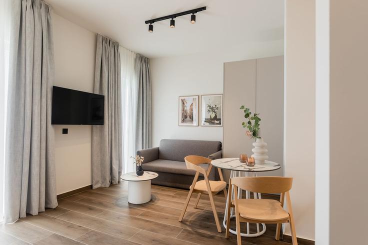 Elegantly designed living room with modern furnishings in an apartment at Building Kleomenous - zoialiving - 1299448 - ATH in Central Athens, Athens