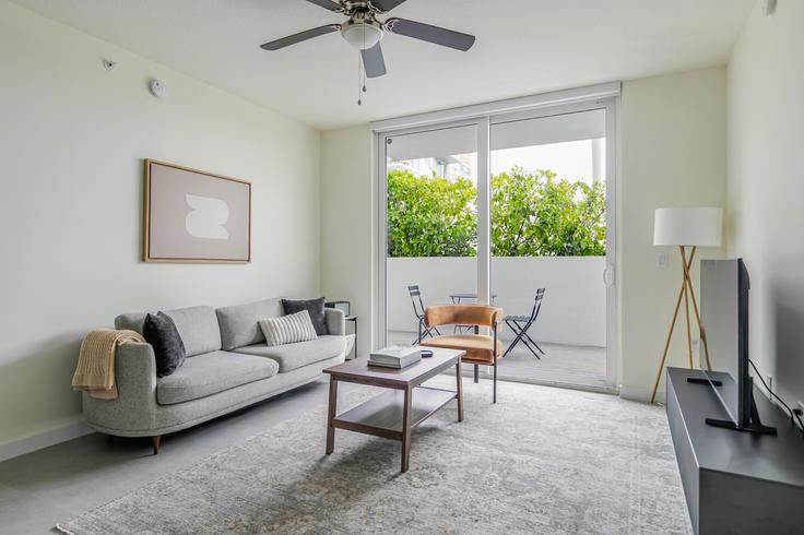Elegantly designed living room with modern furnishings in an apartment at Brickell West City Rentals in Miami, Miami Elegantly designed living room with modern furnishings in an apartment at Brickell West City Rentals in Miami, Miami