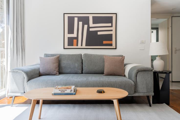 Elegantly designed living room with modern furnishings in an apartment at Allenby 114 in Tel Aviv, Tel Aviv