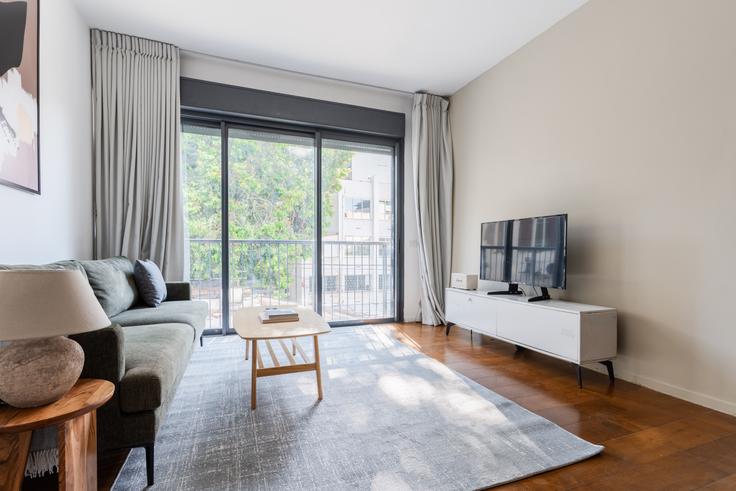 Elegantly designed living room with modern furnishings in an apartment at Allenby 114 in Tel Aviv, Tel Aviv