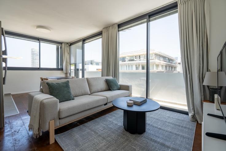 Elegantly designed living room with modern furnishings in an apartment at Allenby 114 in Tel Aviv, Tel Aviv