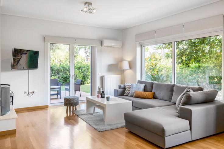 Chic living room with minimalist design from a furnished apartment in Glyfada, Athens