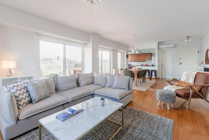 Elegantly designed living room with modern furnishings in an apartment at bfd1c5ea-5de7-47f3-acab-bf2c62ecd610 in Glyfada, Athens