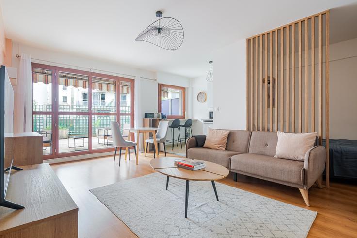 Elegantly designed living room with modern furnishings in an apartment at Victor massé 36 in 9th arrondissement, Paris