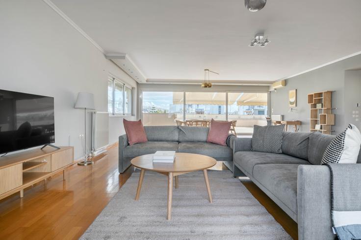 Chic living room with minimalist design from a furnished apartment in Glyfada, Athens