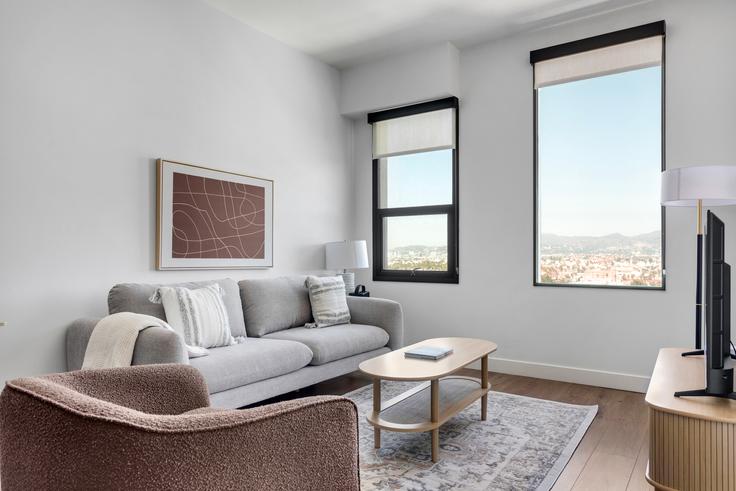 Elegantly designed living room with modern furnishings in an apartment at Thompson in Los Angeles, Los Angeles