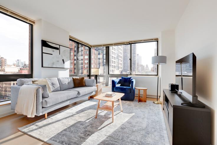 New York ManhattanのThe Lyricのアパートメントにある、モダンな家具を備えたエレガントなデザインのリビングルーム New York ManhattanのThe Lyricのアパートメントにある、モダンな家具を備えたエレガントなデザインのリビングルーム