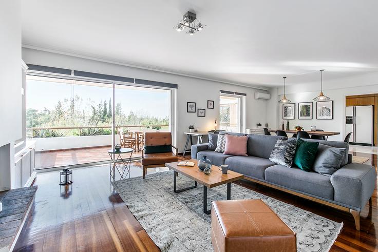 Elegantly designed living room with modern furnishings in an apartment at cf0a536c-3f18-4431-bca5-de654a5a3b17 in Politeia, Athens