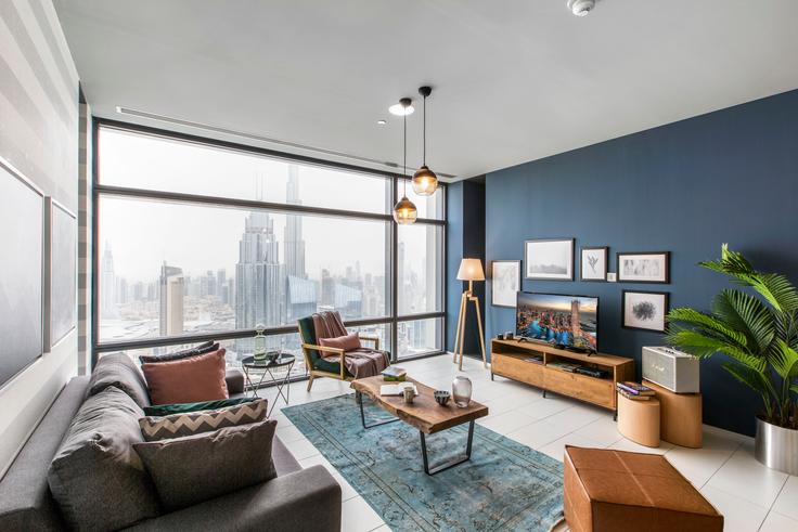 Chic living room with minimalist design from a furnished apartment in Index Tower, Dubai