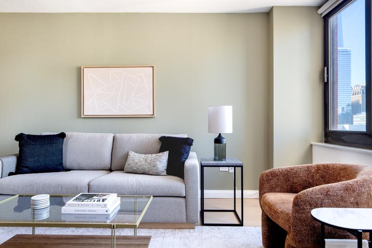 Elegantly designed living room with modern furnishings in an apartment at Tribeca Tower in Tribeca, New York